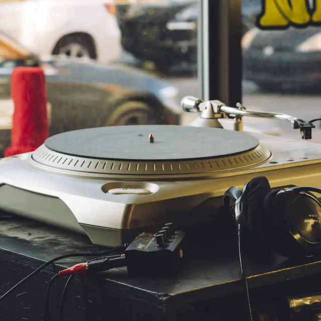 Vintage turntable with a record on the platter